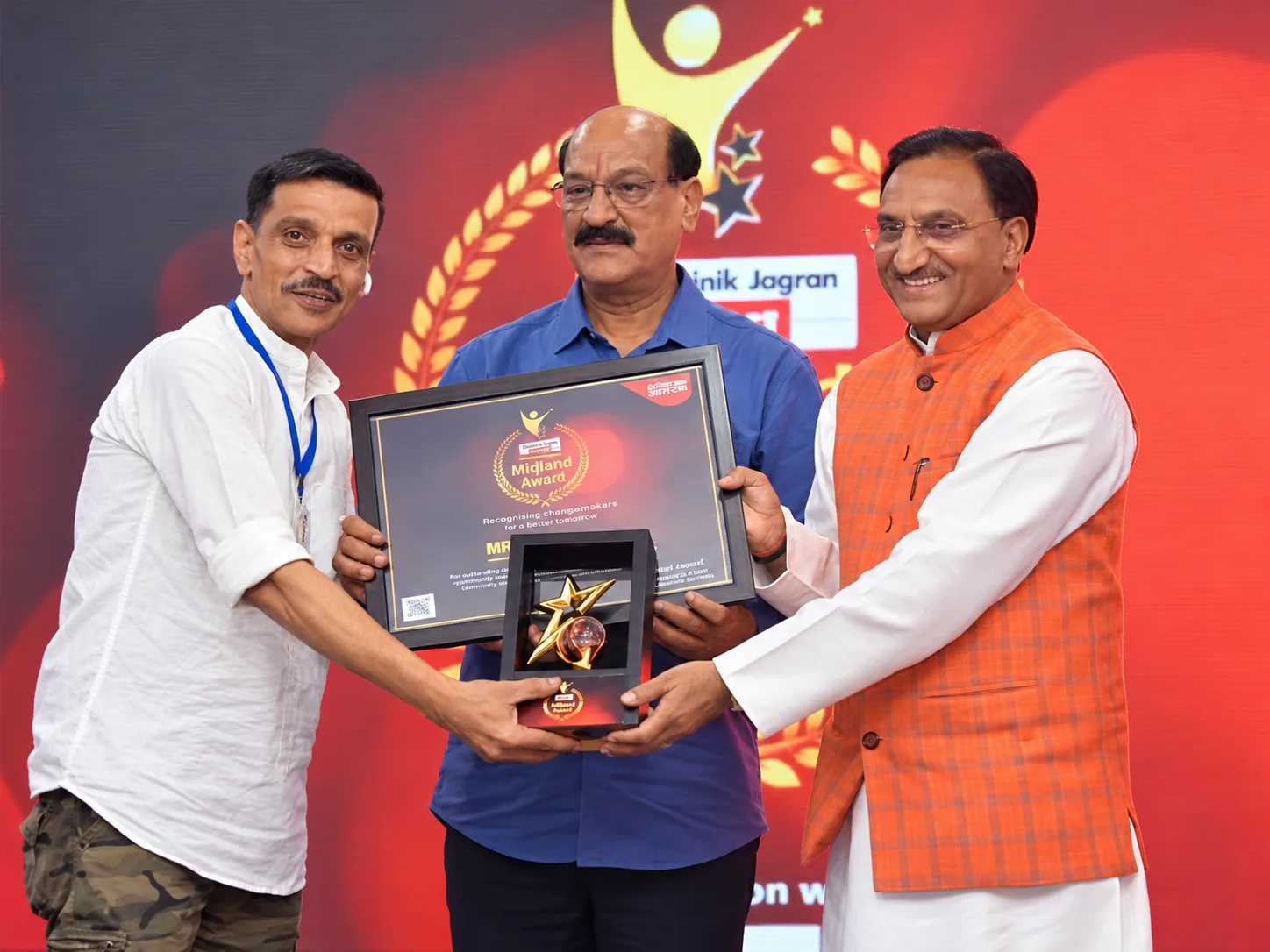 A public award handover and group photograph
