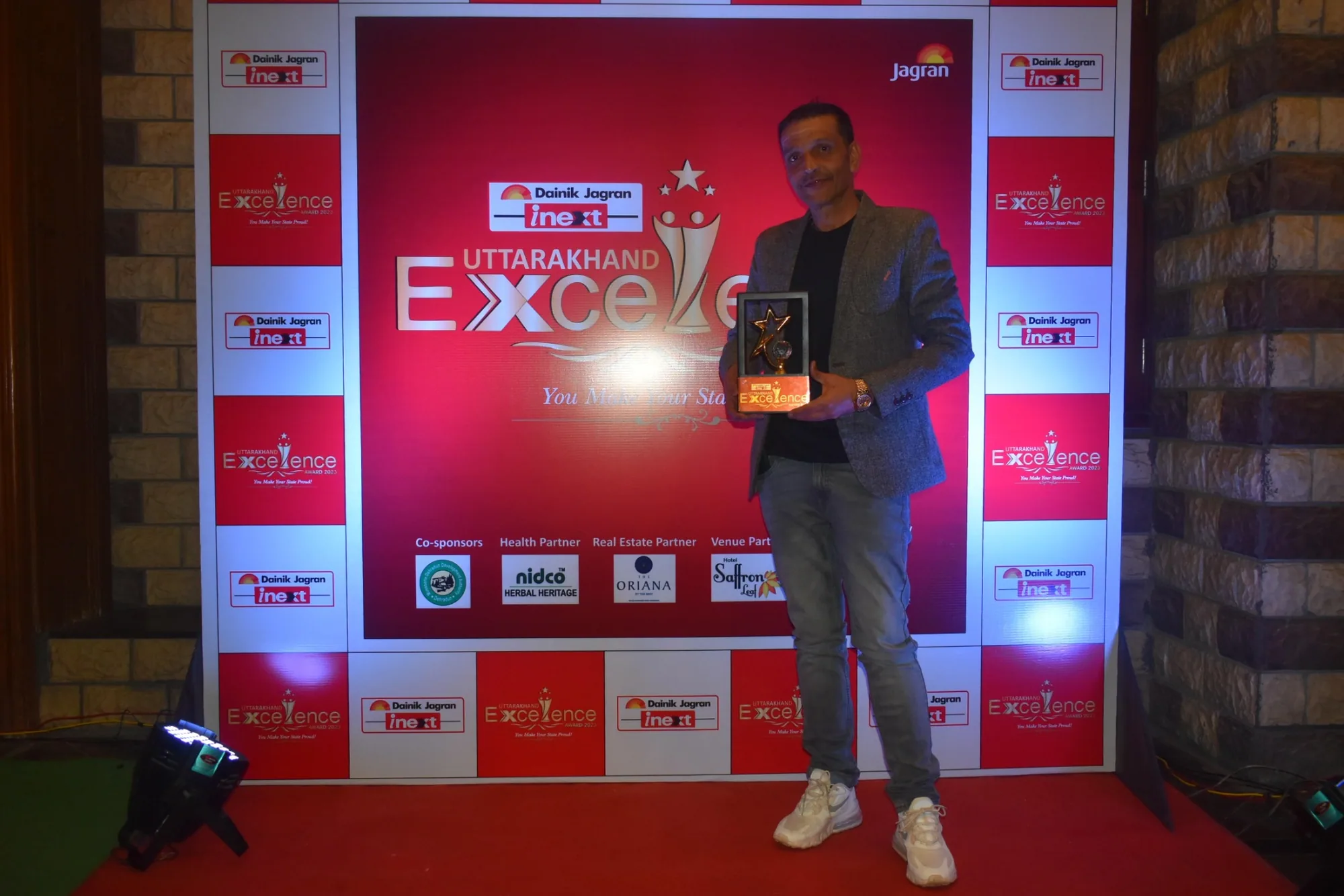 Ravinder Singh pictured with an award at a public recognition event