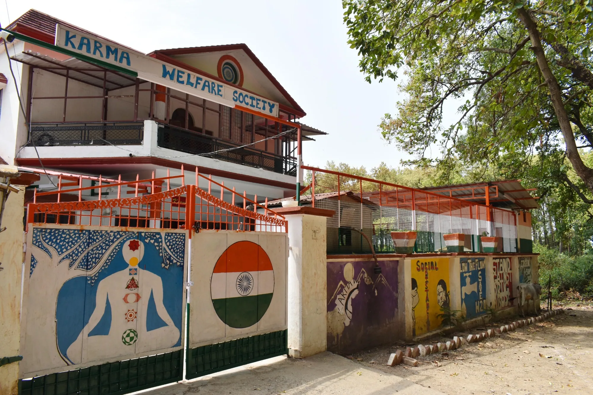 Side view of Karma Welfare Society campus surrounded by trees